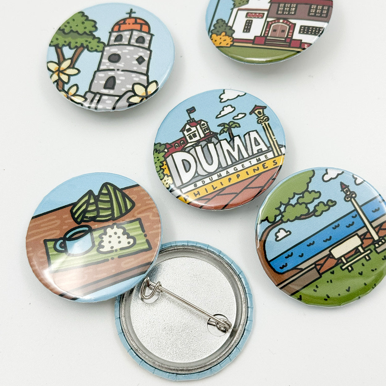 Button Pin, Duma, DumaGetMe, Dumaguete city, Negros Oriental, Souvenir, pins, art, artistic, creative, Kat Banay, Bell Tower, Pantawan, Cathedral, Pa-Initan, Rizal Boulevard, Iconic spots, tourist, touristic destinations, Landmarks, close up