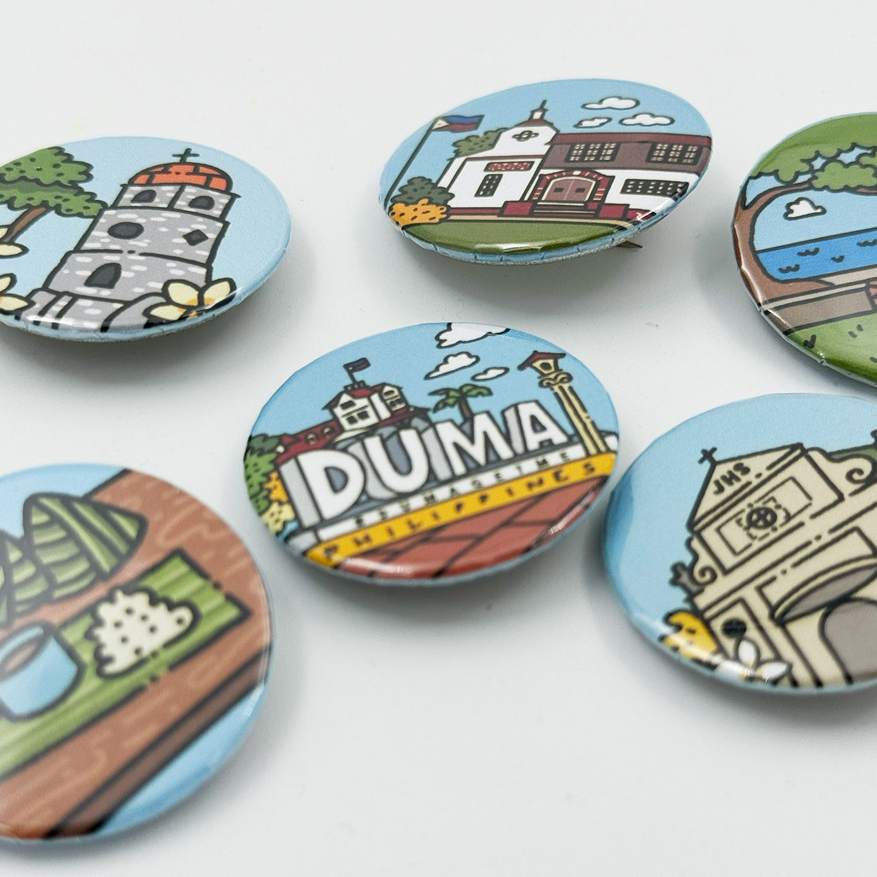 Button Pin, Duma, DumaGetMe, Dumaguete city, Negros Oriental, Souvenir, pins, art, artistic, creative, Kat Banay, Bell Tower, Pantawan, Cathedral, Pa-Initan, Rizal Boulevard, Iconic spots, tourist, touristic destinations, Landmarks, close up